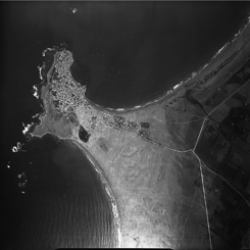 Aerial view of Tyre, including the original island towards the left, the continental coast to the right and the tombolo that links them together in the middle (photograph: Poidebard archives at the Univeriste Saint Joseph).